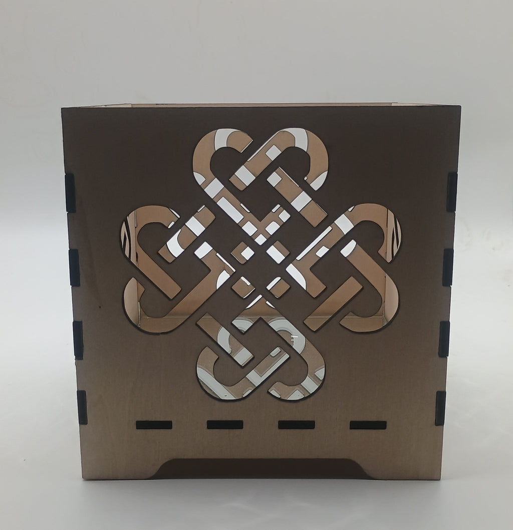 Decorative box with Celtic knot design on a white background