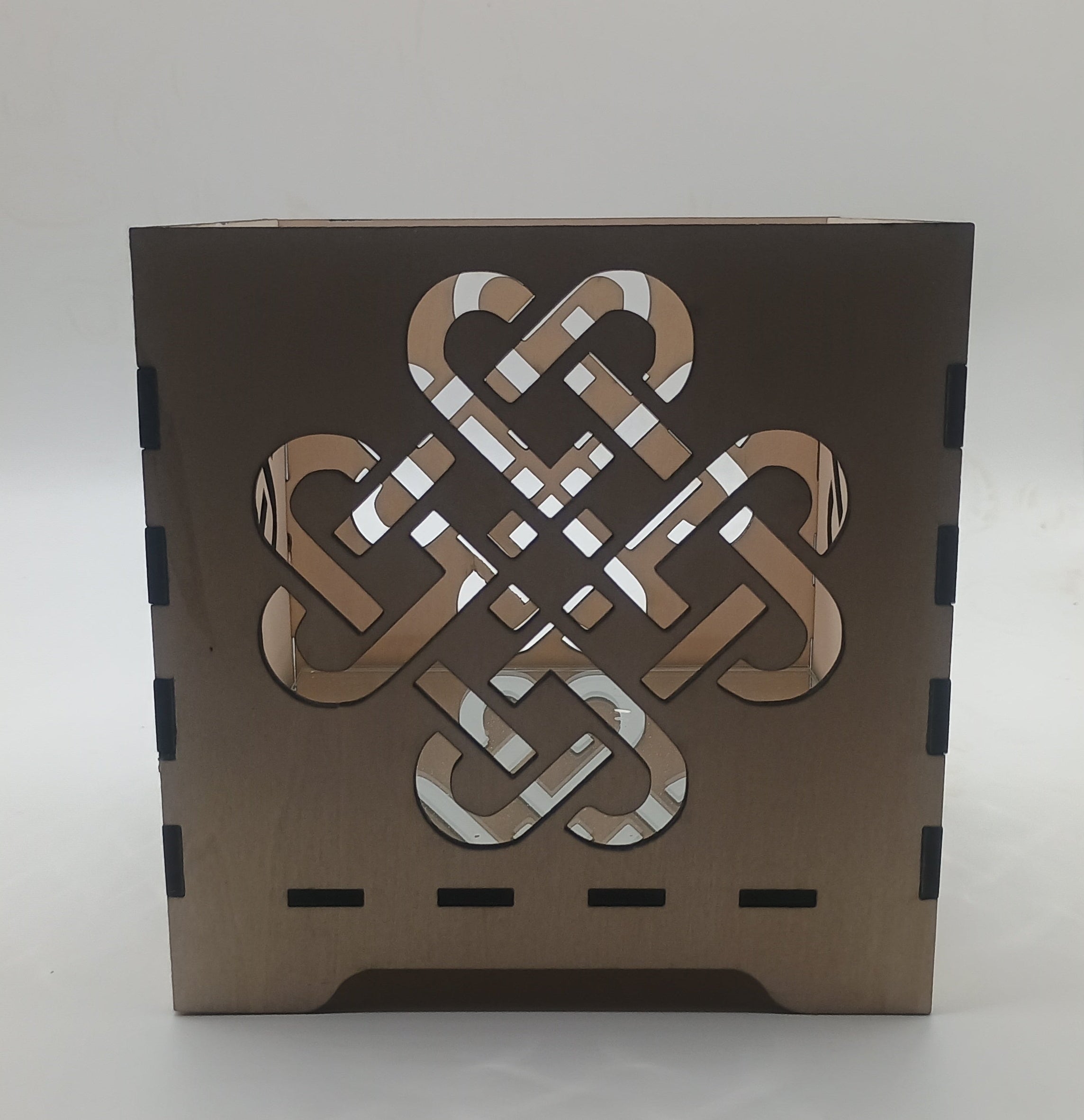 Decorative box with Celtic knot design on a white background