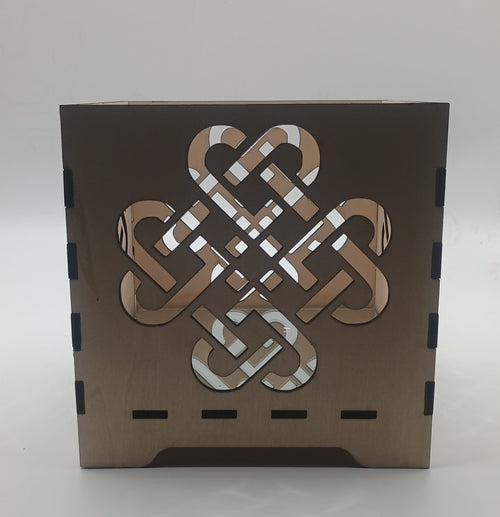 Decorative box with Celtic knot design on a white background