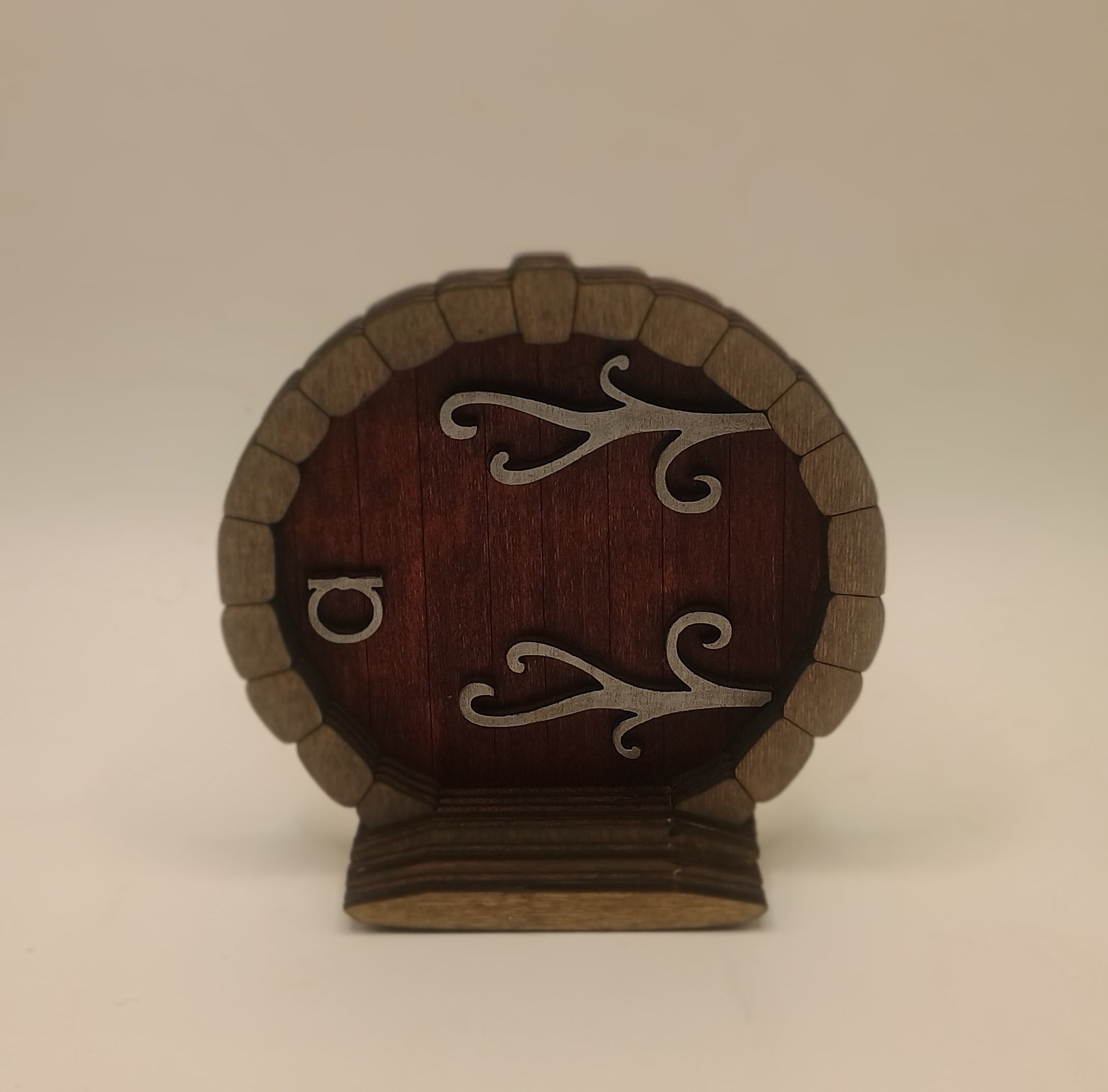 Small round door with metal accents