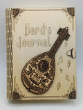 A wooden box titled 'Bard's Journal' featuring a laser-engraved mandolin on the front cover.
