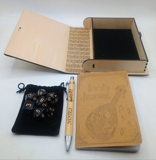 A wooden keepsake box set with a black velvet pouch containing polyhedral dice, a matching wooden pen, and journal for notes